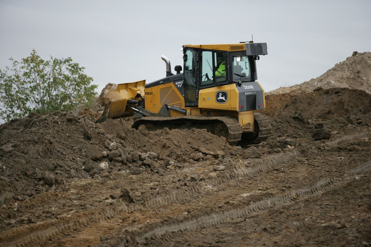 John Deere dozer pushing dirt on a Central Florida site development job